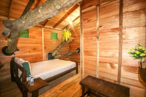 Postel nebo postele na pokoji v ubytování Green Park Safari House & Eco Tree House