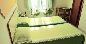 Letto o letti in una camera di Albergo Natucci