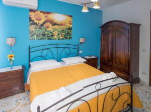 Postel nebo postele na pokoji v ubytování Vivere a colori