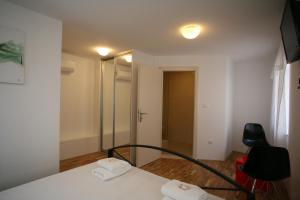 Postel nebo postele na pokoji v ubytování Rooms Beljan + 36 fotografií