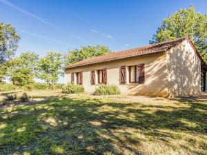 an old house in a field with a yard at Holiday home with swimming pool in Salignac