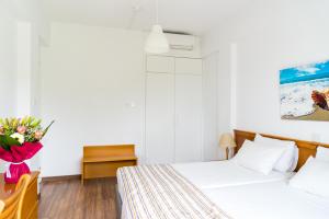 Letto o letti in una camera di Helios Bay Hotel and Suites