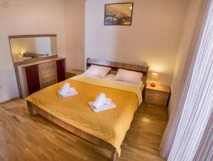 Voodi või voodid majutusasutuse Apartments and rooms Marija toas