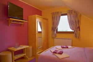 Katil atau katil-katil dalam bilik di Apartments Tratinčica
