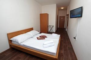 Posteľ alebo postele v izbe v ubytovaní Hotel Arko