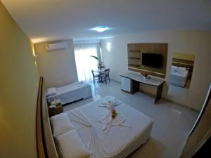 Postel nebo postele na pokoji v ubytování Aquaville Apart Hotel