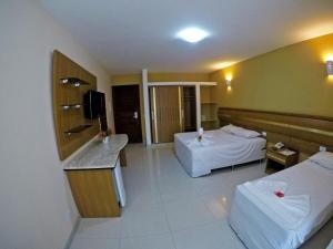 Postel nebo postele na pokoji v ubytování Aquaville Apart Hotel