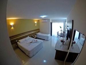 Postel nebo postele na pokoji v ubytování Aquaville Apart Hotel