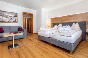 Łóżko lub łóżka w pokoju w obiekcie Hotel Unterhof