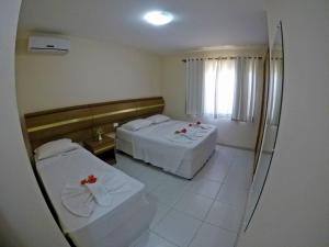 Postel nebo postele na pokoji v ubytování Aquaville Apart Hotel