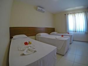 Postel nebo postele na pokoji v ubytování Aquaville Apart Hotel