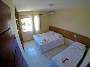 Postel nebo postele na pokoji v ubytování Aquaville Apart Hotel