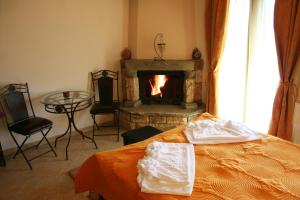 Postel nebo postele na pokoji v ubytování Evilion Traditional Inn