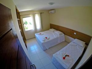 Postel nebo postele na pokoji v ubytování Aquaville Apart Hotel