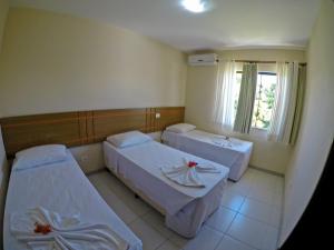 Postel nebo postele na pokoji v ubytování Aquaville Apart Hotel