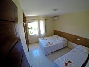 Postel nebo postele na pokoji v ubytování Aquaville Apart Hotel