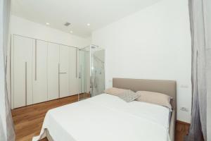 Ένα ή περισσότερα κρεβάτια σε δωμάτιο στο Home Diano Marina