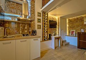 a kitchen with a sink and a counter top at Vinodorum Apartments in Cluj-Napoca