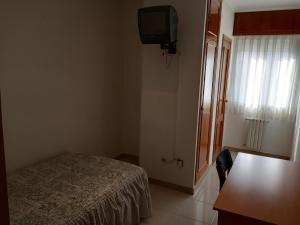 Postel nebo postele na pokoji v ubytování Hostal Mobydick2