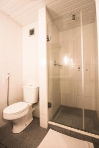 a bathroom with a toilet and a shower at Amapá Hotel in Macapá