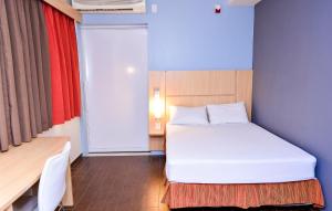 Cama ou camas em um quarto em Amapá Hotel