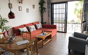 Posezení v ubytování La Hacienda BuenVivir - Apartamentos