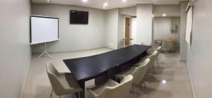 Área de negócios e/ou sala de conferências em Amapá Hotel