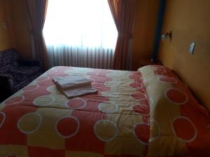 Postel nebo postele na pokoji v ubytování Hotel Utama
