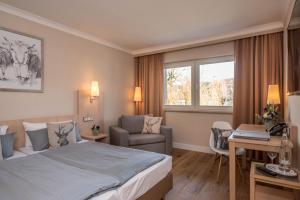 Postel nebo postele na pokoji v ubytování Ammersee-Hotel