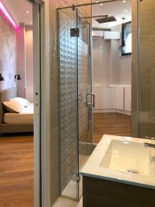 a bathroom with a shower and a sink at Europa Apartment in Tirana