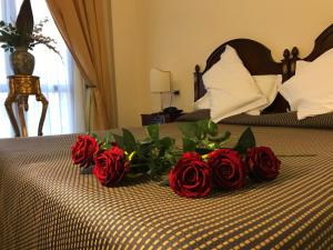 Postel nebo postele na pokoji v ubytování Grand Hotel Palace
