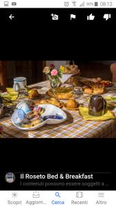 a table topped with plates of food on top at B&B Il Roseto in Spilamberto