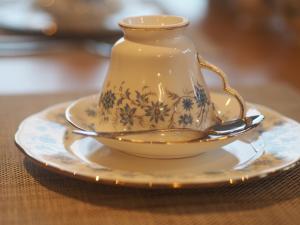 a tea cup and saucer on a table at Gort a Phump in Ballydavid