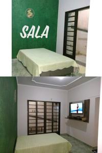 um quarto com uma cama e uma televisão em Aluguel para Temporada em São Roque de Minas
