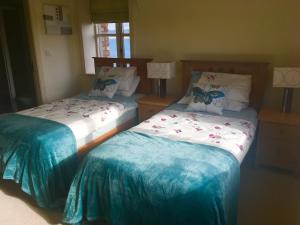 Postel nebo postele na pokoji v ubytování Curlew Apartment