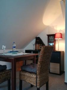 a dining room with a table and two chairs at Ferienappartement im Herzen der Stadt in Dessau