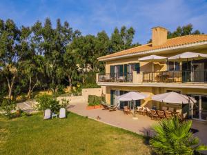 A garden outside Kounopetra Beach Luxury Villas