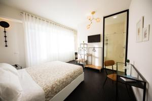 Cama o camas de una habitación en Loraia Design Rooms