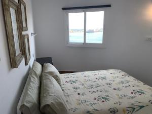 A bed or beds in a room at Paseo Marítimo, Los Cristianos Over the sea FREE WIFI