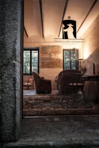 a living room filled with furniture and a window at Albergue Convento Del Camino in Tui