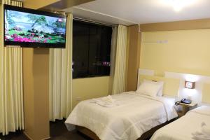 Voodi või voodid majutusasutuse Kaaro Hotel Puno toas