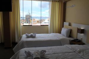 Kaaro Hotel Puno客房内的一张或多张床位