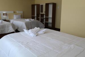Kaaro Hotel Puno客房内的一张或多张床位