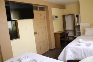 Kaaro Hotel Puno客房内的一张或多张床位