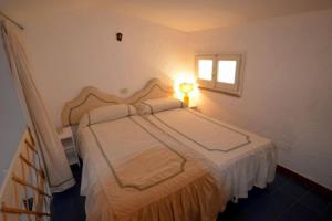 Una cama o camas en una habitación de Apt. Portolano By SolturElba