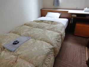 Postel nebo postele na pokoji v ubytování Matsue Plaza Hotel