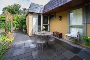 a patio with a table and chairs on it at Cygnet, Studio on Sturt in Wendouree