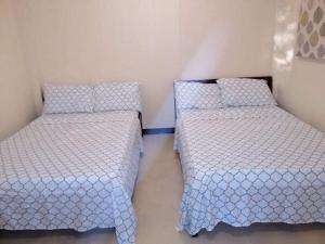 Postel nebo postele na pokoji v ubytování Maharlika siargao 2 pax