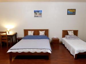 Postel nebo postele na pokoji v ubytování Minine Guesthouse