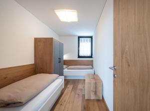 a bedroom with a bed and a toilet in a room at naturApart in Brunico